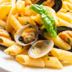 stock-photo-penne-allo-scoglio-typical-italian-pasta-with-clams-and-mussels-1130884268